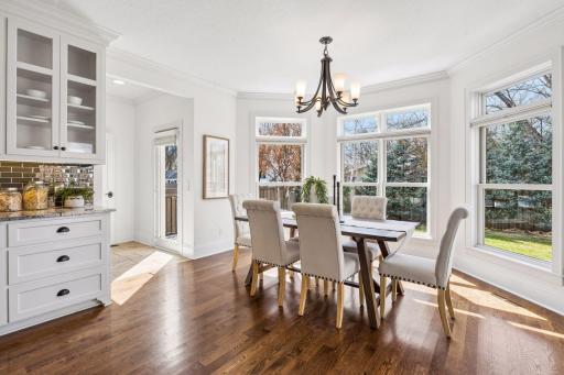 From candlelit dinners to lazy Sunday brunches, this dining room delivers, wrapped in natural light, surrounded by professionally landscaped views, and flowing directly onto the back deck for indoor/outdoor living at its finest.