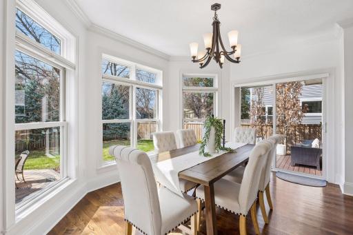 The dining room strikes the perfect balance, open to the living room for effortless entertaining yet privately framed by stunning backyard landscaping and a seamless slider out to the deck and patio.