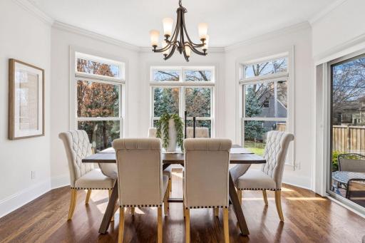 Tucked into a private bay window with lush landscaped backyard views and direct access to the deck, the dining room is a serene escape that connects beautifully to nature..