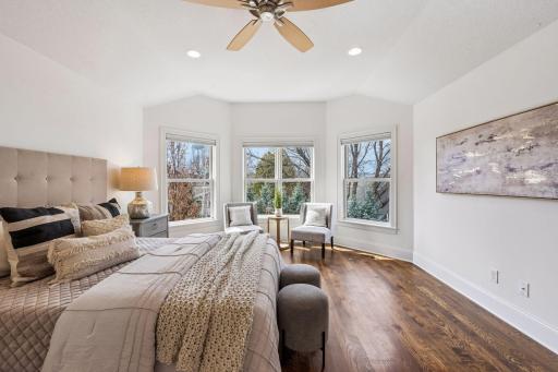 Spacious, serene, and bathed in natural light, the primary suite features a beautiful bay window sitting area and a room for a king bed and full furniture suite. Your own private sanctuary above it all.