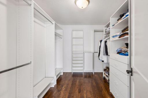 Dual his and hers closet offers generous beautifully organized space for two because a truly exceptional primary suite means never having to compromise on storage or style.