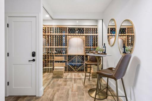 A show-stopping wine cellar designed by Jay of All Trades offers the perfect blend of function and drama, an entertainer's signature feature that sets this home apart from everything else on the market.