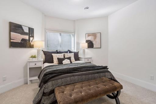 The light filled lower level guest room space is perfectly appointed - ideal for guests.