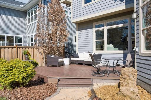A stunning Jim Hansen stone water feature anchors the outdoor space with natural beauty and tranquil ambiance, the kind of landscape detail that turns a backyard into a private sanctuary.