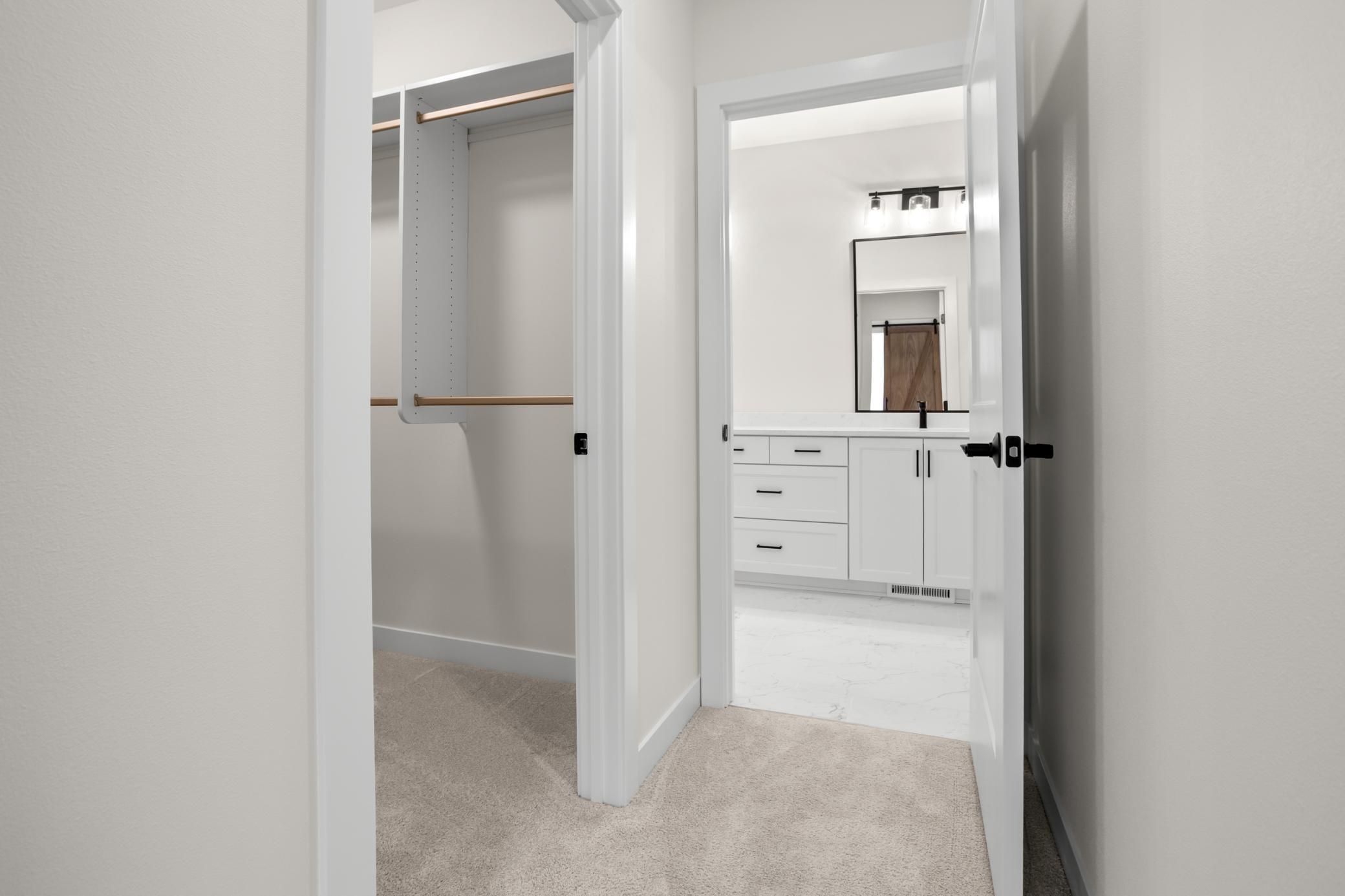 Primary Walk-in Closet and entry to Bath
