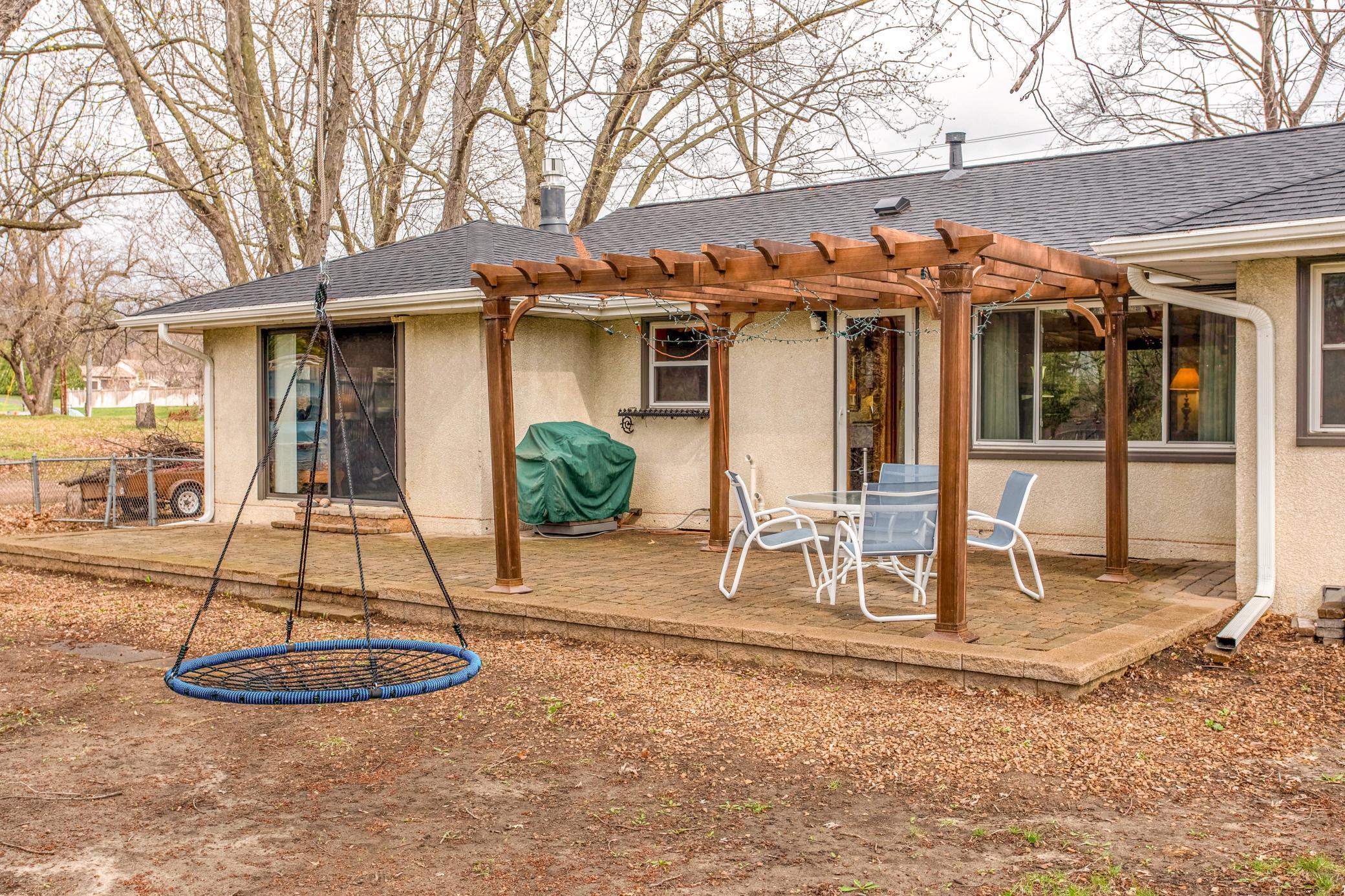 Expansive backyard with garden space and plenty of room for outdoor activities, pets, or future enhancements.