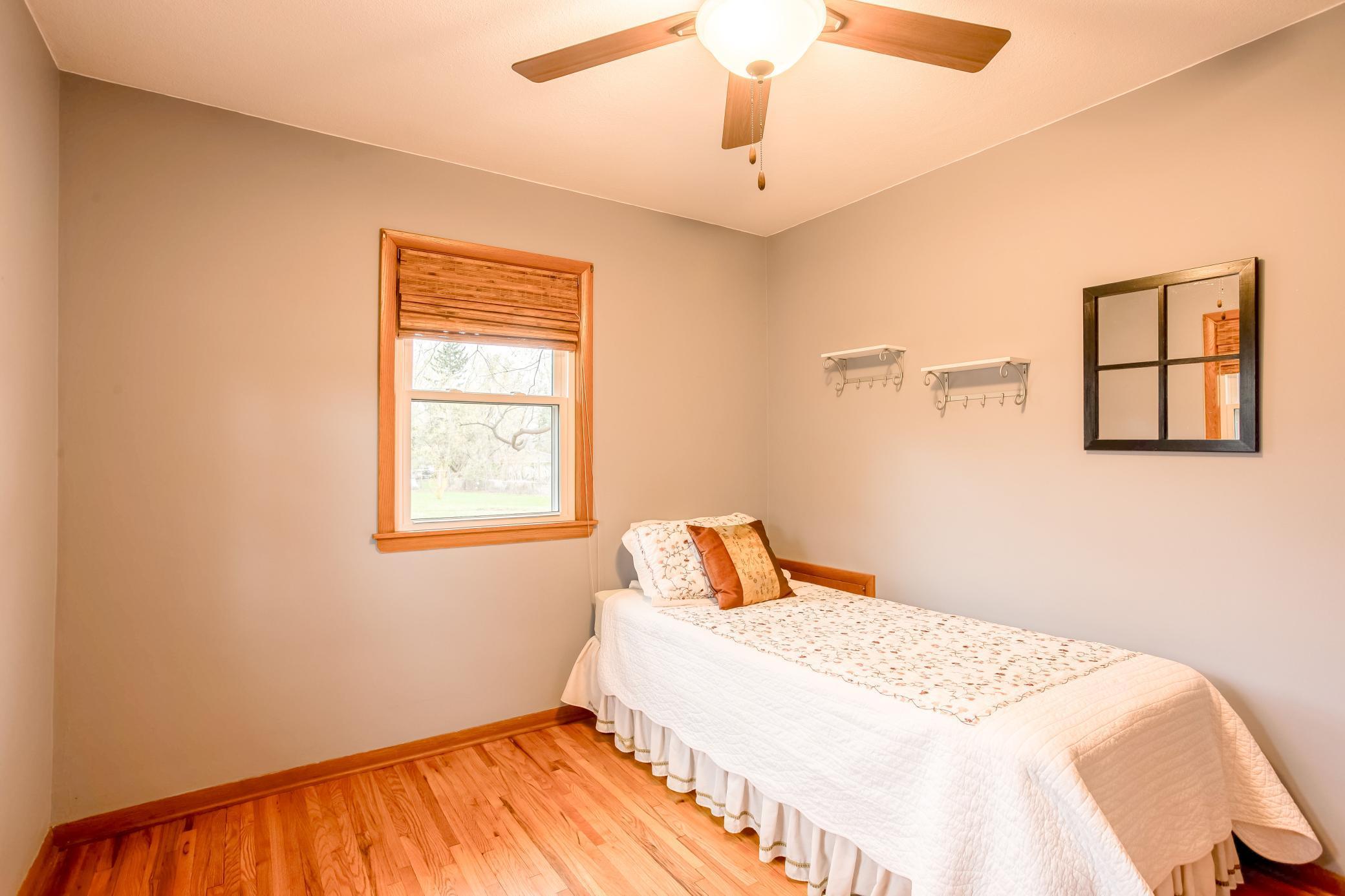 Comfortable bedroom featuring a clean layout and soft, neutral tones.