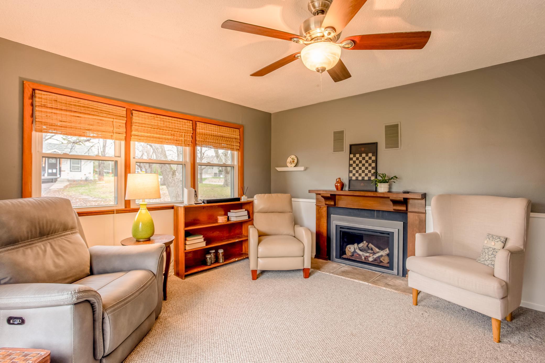 Inviting family room highlighted by a charming new fireplace and comfortable seating area.