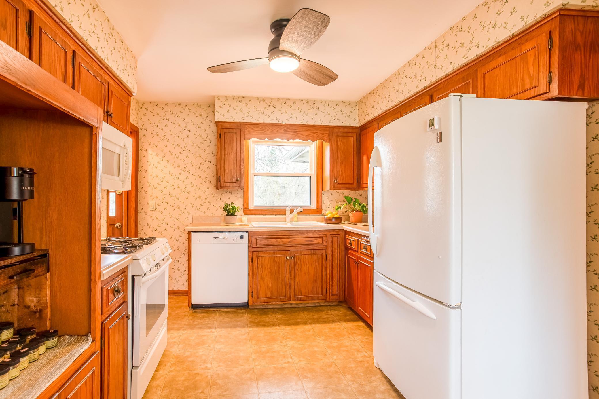 Bright and functional kitchen featuring ample cabinetry and natural light.