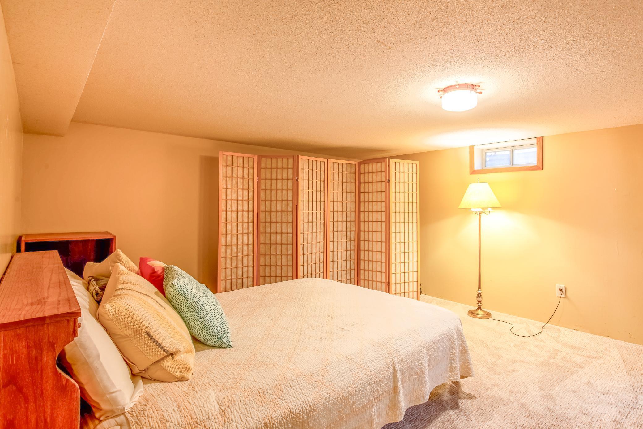 Spacious rec room featuring neutral tones and flexible layout options for comfortable living or to add equity.