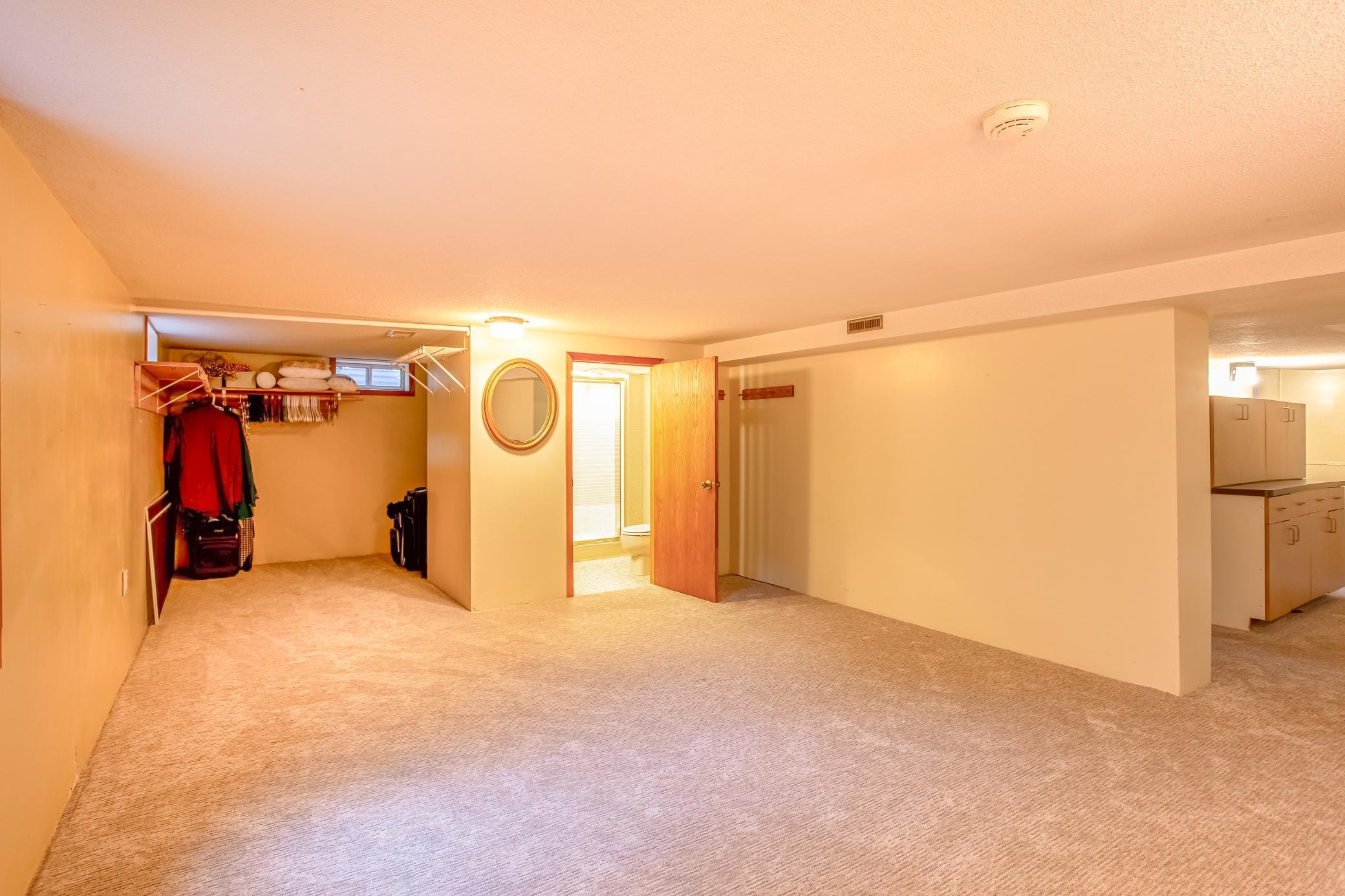 Expansive lower-level rec room offering endless possibilities for recreation, media, or additional living space.