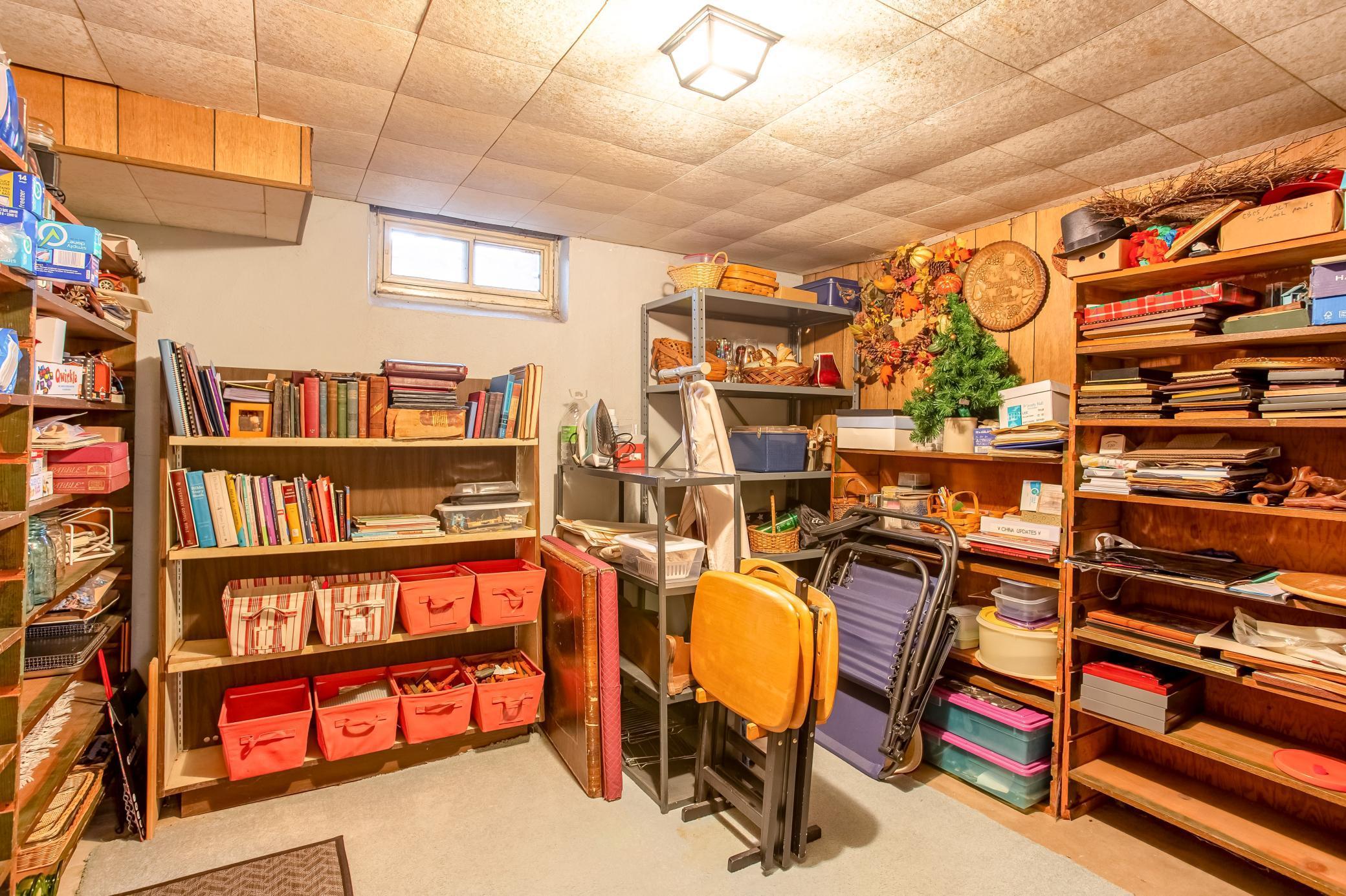 Dedicated storage room with shelving, providing excellent organization and extra space for belongings.
