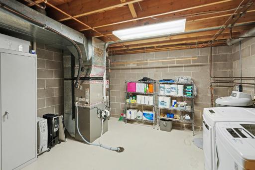 Spacious mechanical room with newer Lennox furnace (2023)