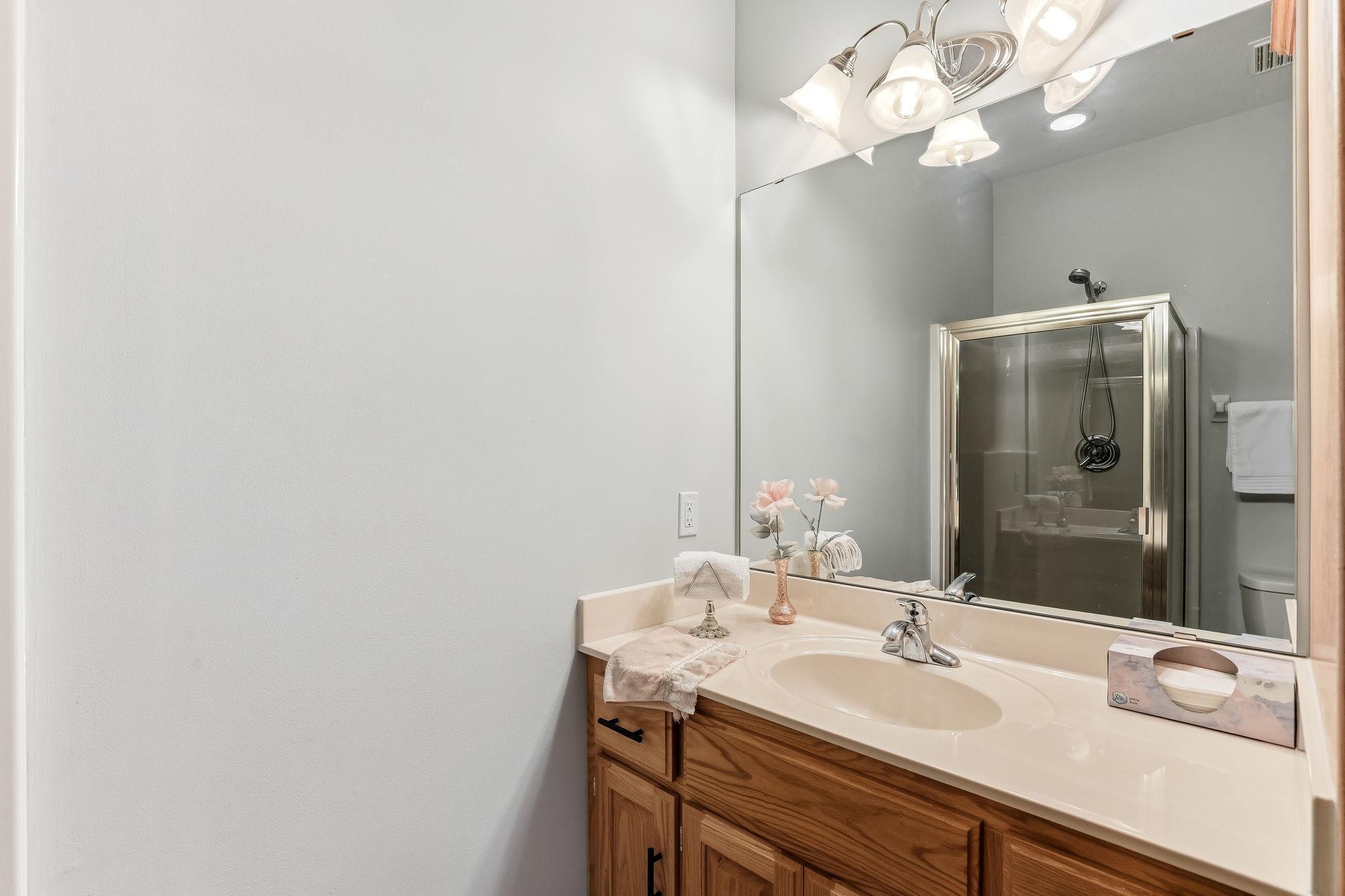 Main-level 3/4 bath offering comfort and convenience for guests