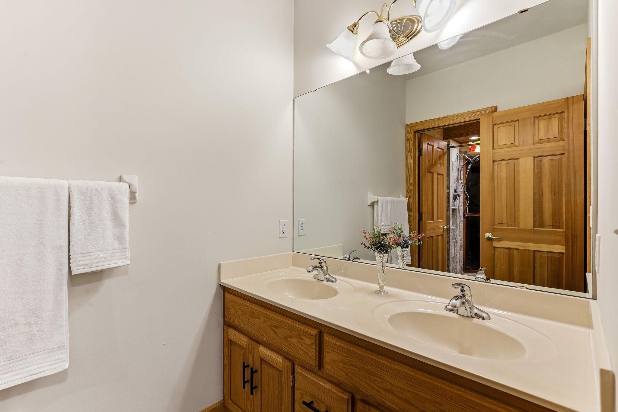Beautifully finished lower-level 3/4 bath offering a luxurious touch for the lower level bedrooms.