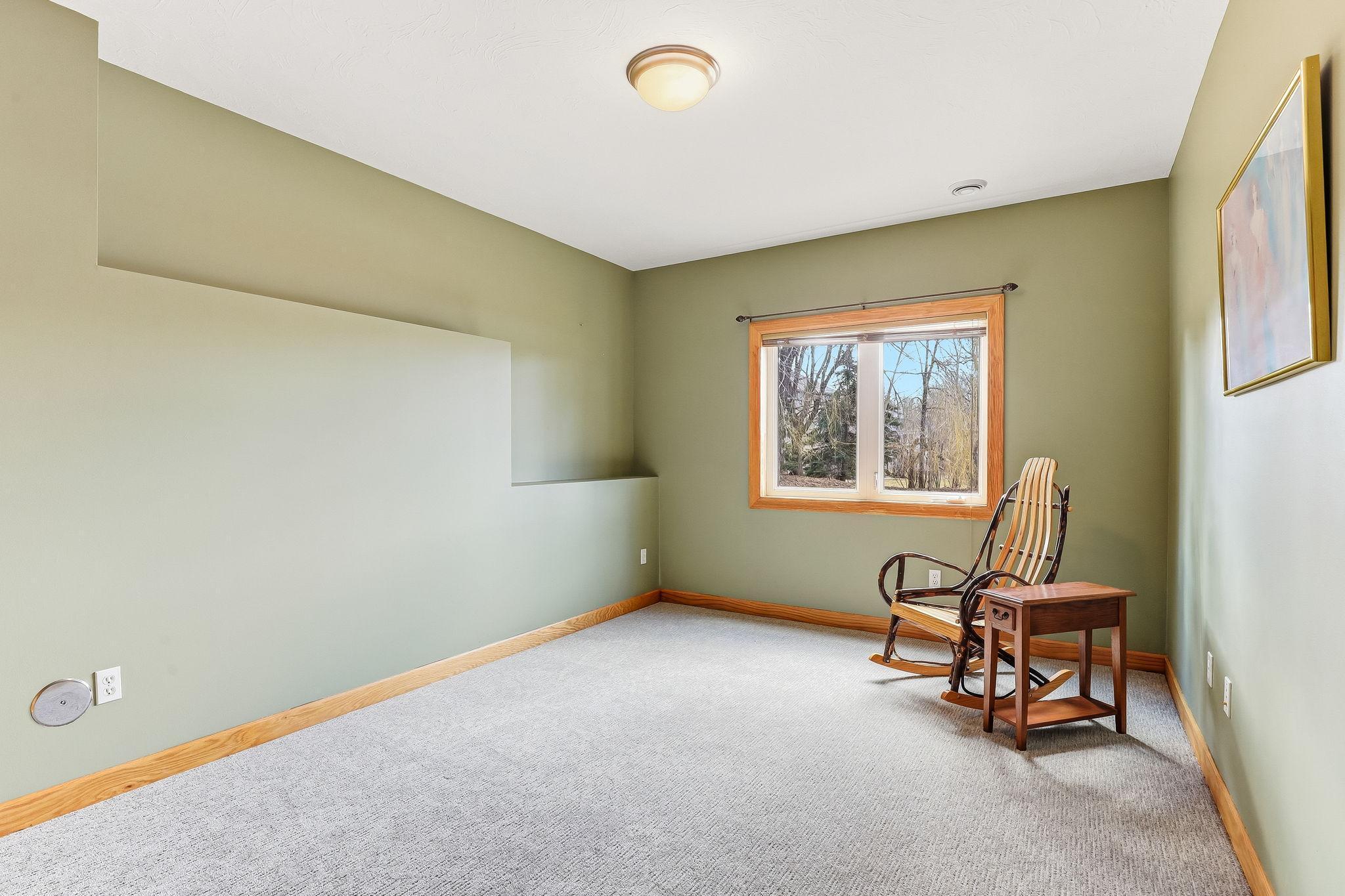 One of three spacious lower-level bedrooms