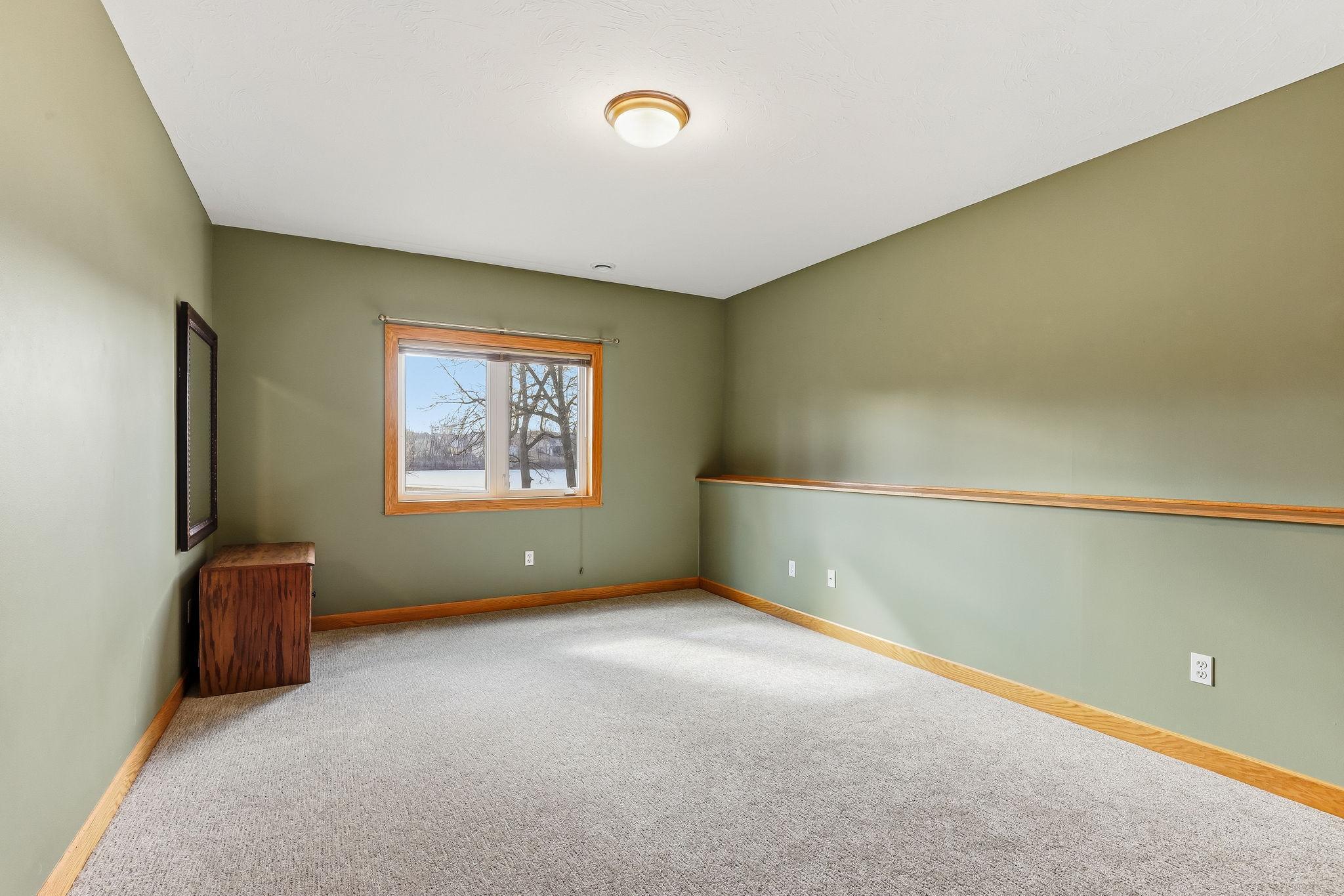 Lower-level third bedroom, part of a convenient three-bedroom layout on this level.