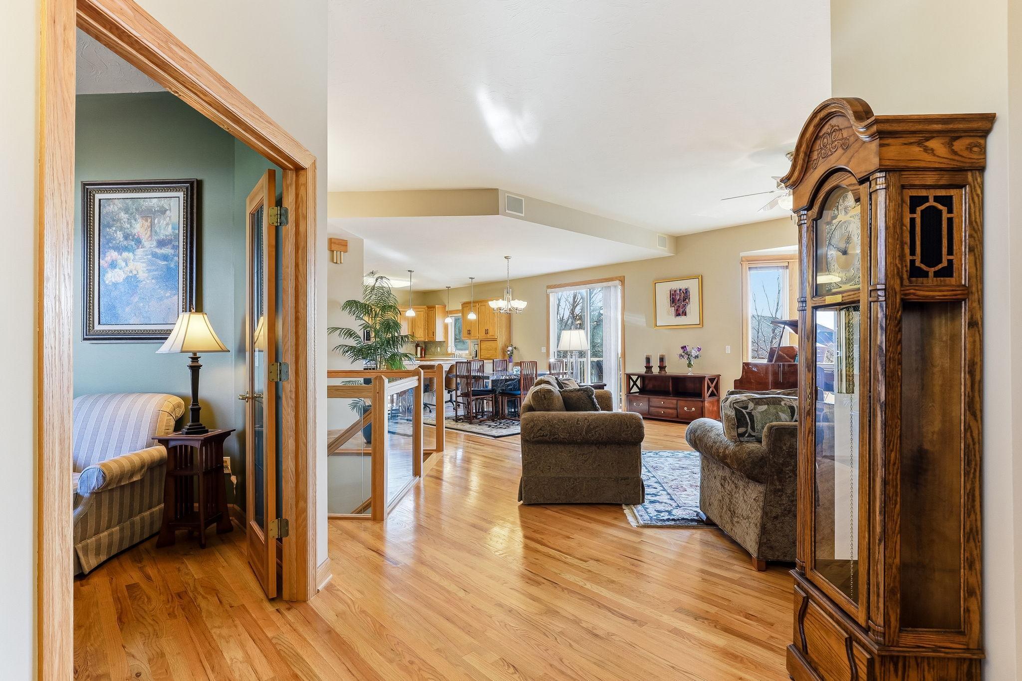 Soaring 10-ft ceilings paired with rich oak hardwood floors for a timeless, elevated feel