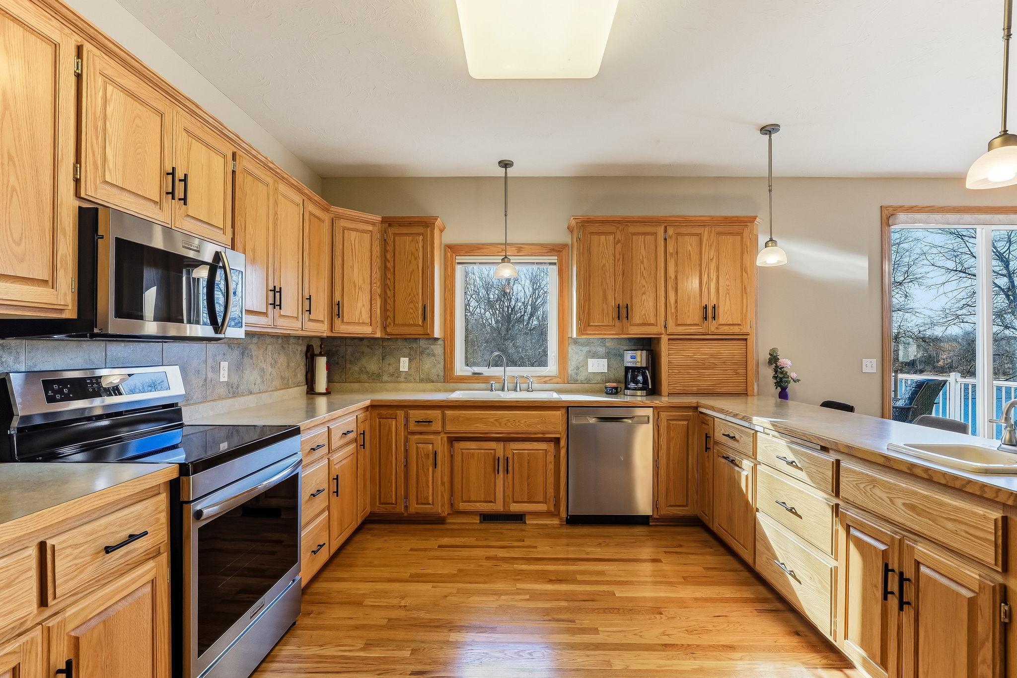 An impressive amount of custom-built oak cabinetry elevating the space with warmth and refinement.