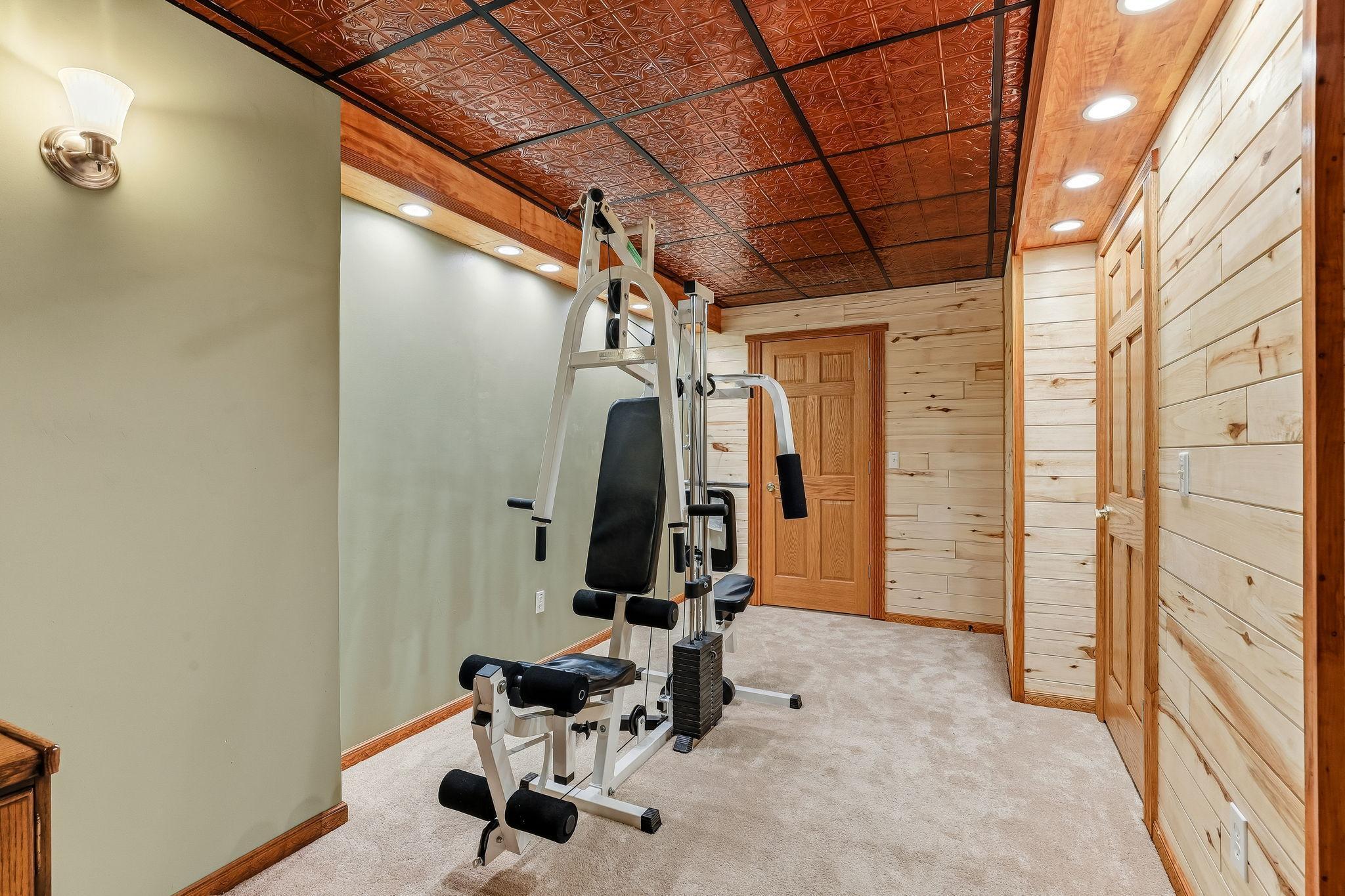 Dedicated lower-level fitness space for convenient at-home training. Beautiful tongue-and groove aspen walls provides a calm and serene place for your workouts.