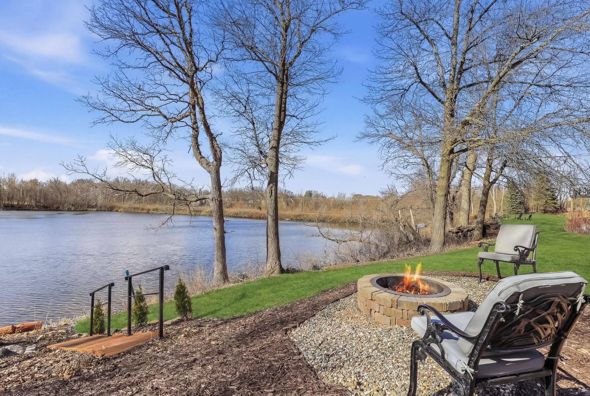 Cozy firepit area by the lake—perfect for evening gatherings, warmth, and enjoying stunning waterfront views and gorgeous sunsets