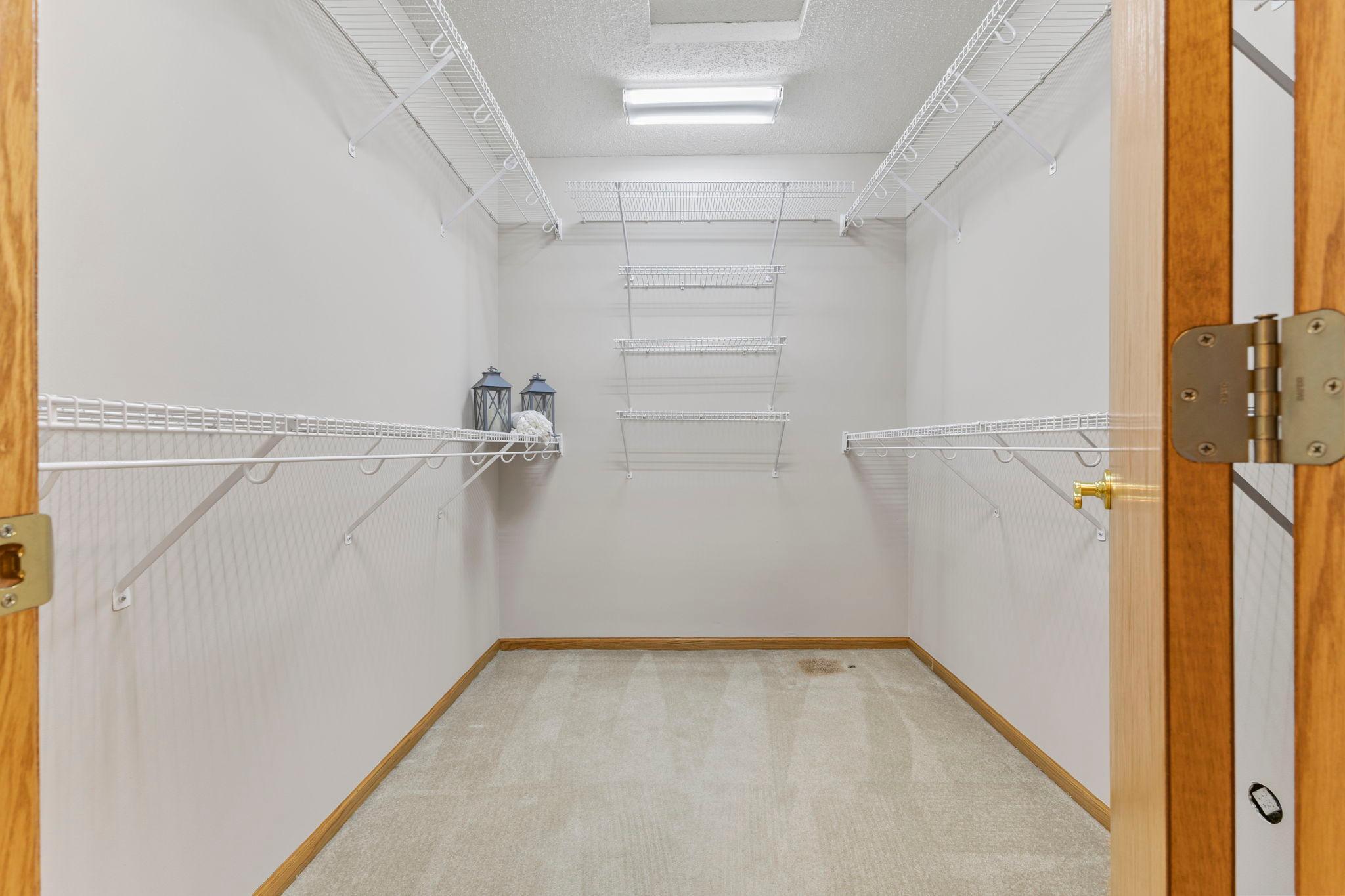 The walk-in closet keeps everything organized with storage for all your clothes and accessories.