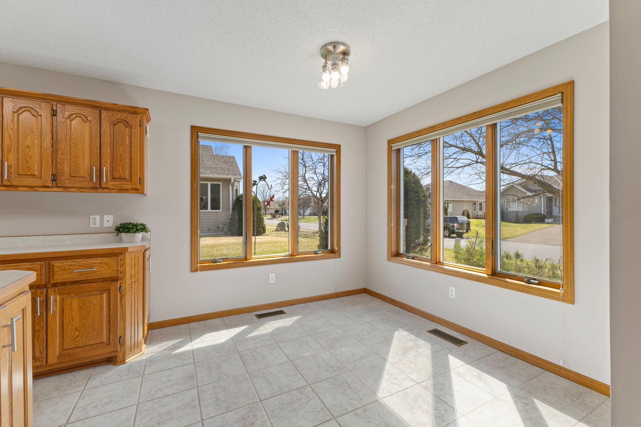 The informal dining area and kitchen is flooded with natural light with two oversized windows!