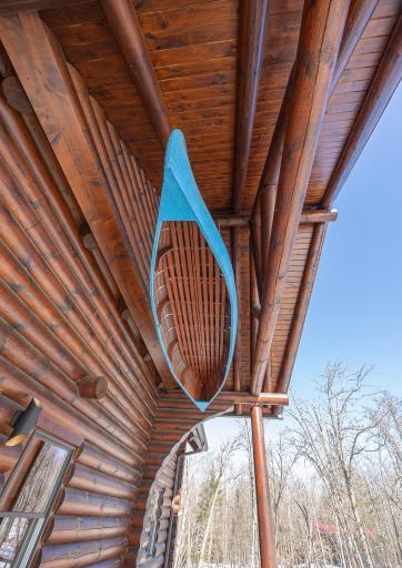 This cool blue canoe greets you as you enter the property