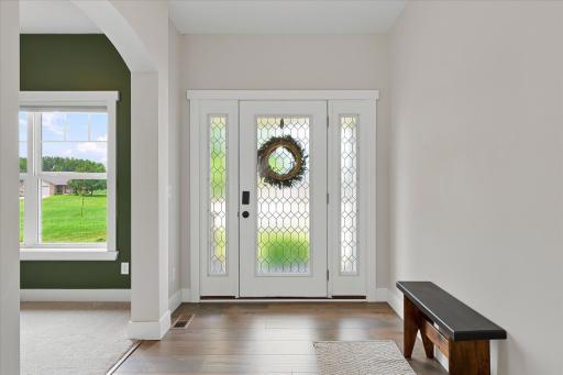 Step inside to the inviting foyer filled with natural light and charming architectural details.