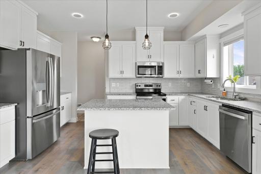 Gorgeous kitchen with granite countertops, S/S appliances, and custom cabinetry.