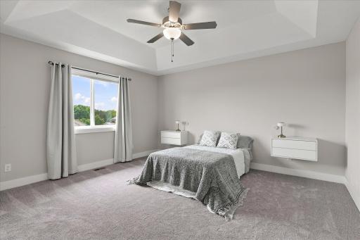 Master bedroom includes 2 built-in nightstands and an elegant recessed ceiling.