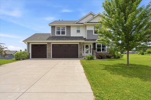 A concrete driveway leads you right into the attached 3-car garage.