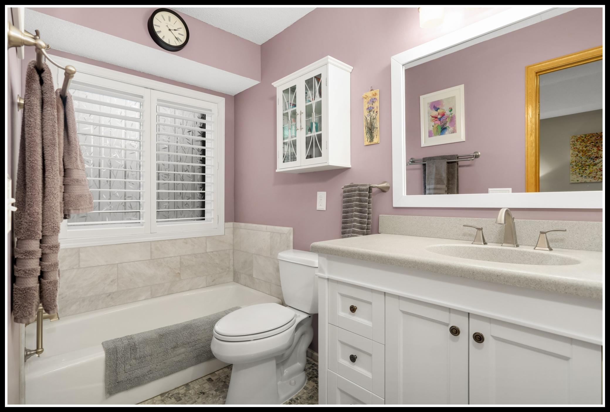 Updated primary bathroom with separate tub. . . .