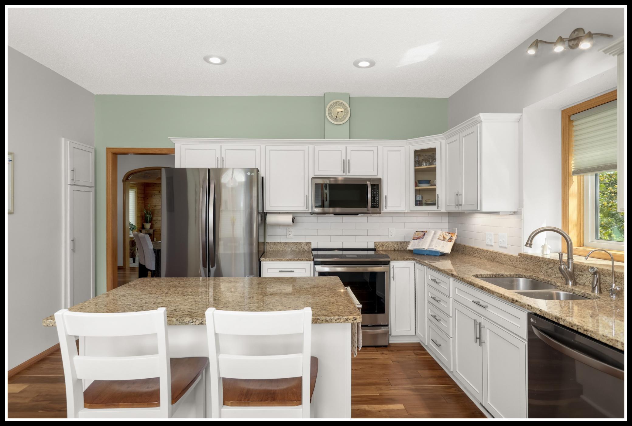 Solid surface countertops, stainless steel appliances