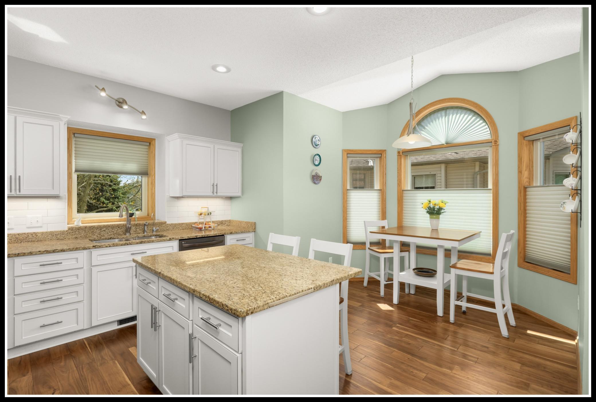 Island provides additional storage, space for preparation and serving, and additional seating