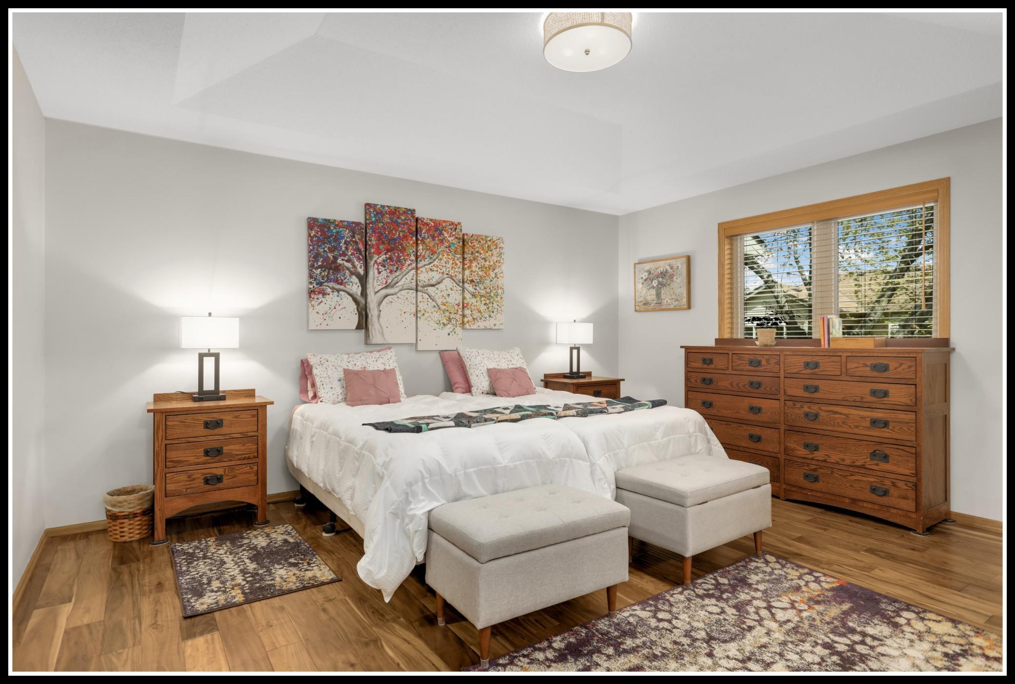 Hardwood floors continue into the primary suite