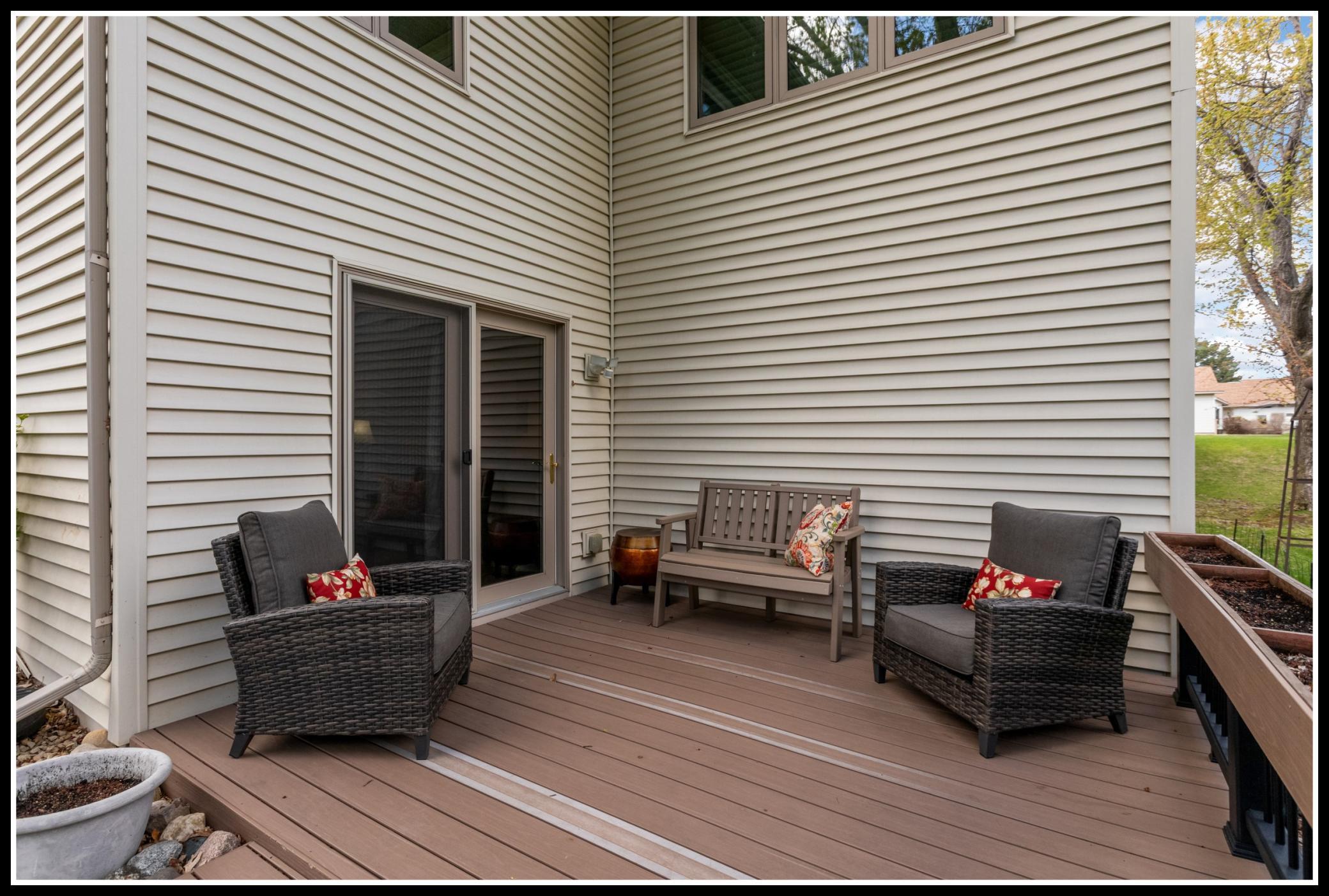 Low-maintenance backyard deck with plenty of space outdoor seating