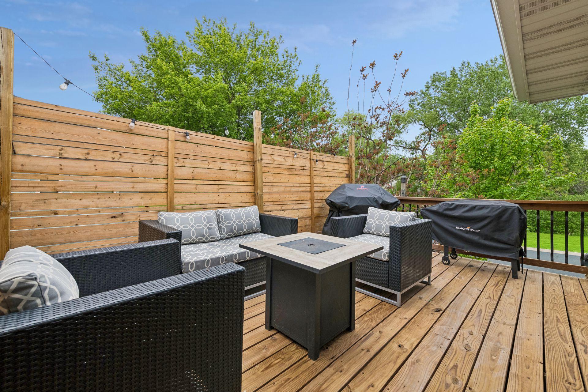 Outside, enjoy the deck with stairs leading to the fenced backyard and firepit, perfect for relaxing or entertaining.