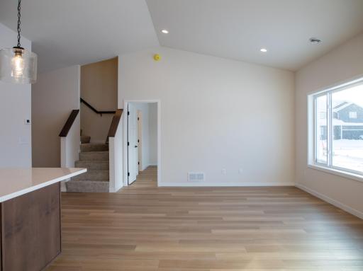 Living Room with view to Primary Suite and Bonus Room