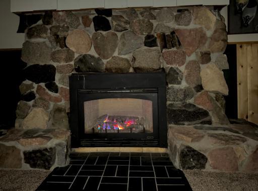 Cozy up to this gas fireplace in the downstairs family room