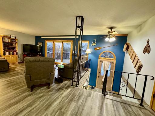 Main floor has an open floor plan with a deck off of the living room