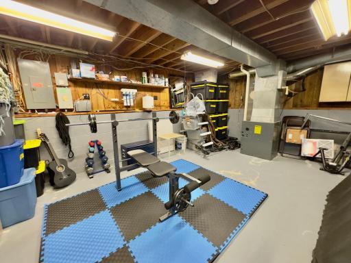 In the lower level, you’re going to love this extra bonus space/utility room/workout room or it could maybe even be turned into another bedroom