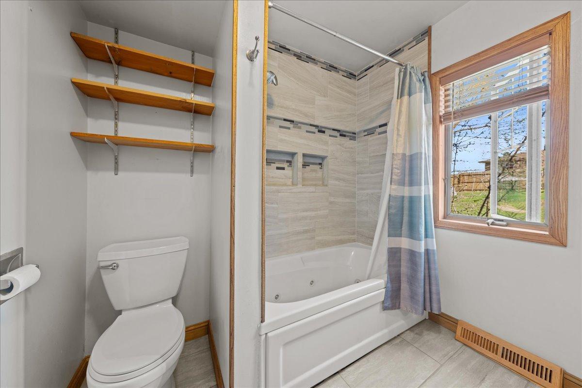 Main floor full bath has a window