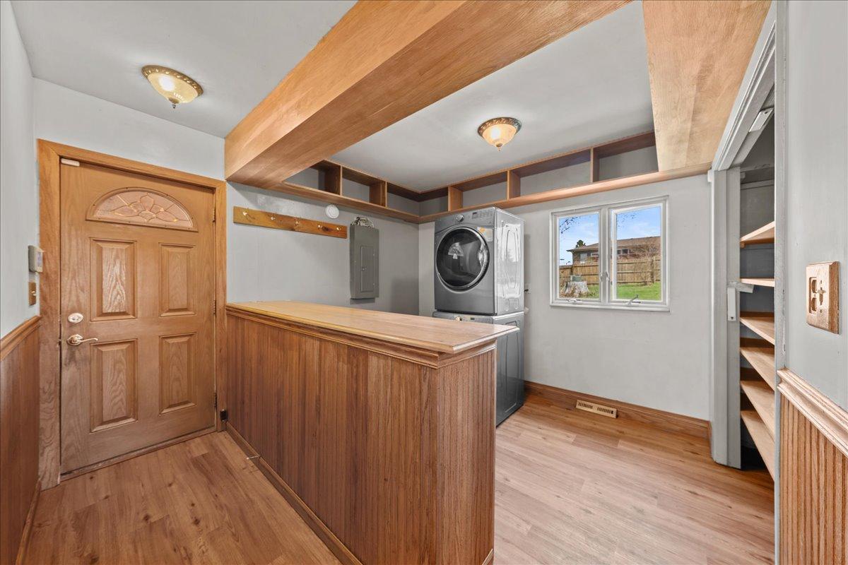 Walk in from the garage to the mud room and laundry area. Lots of storage space!