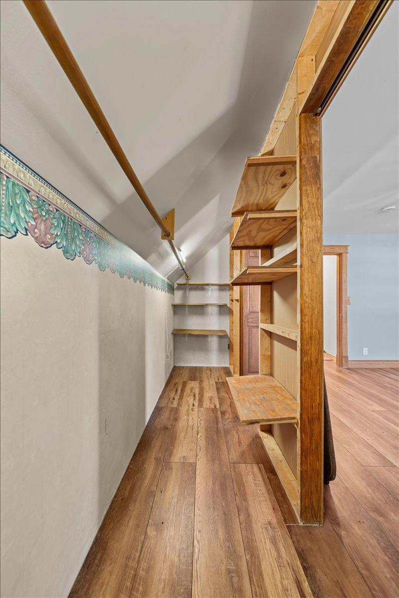 Primary closet has built-in shelves