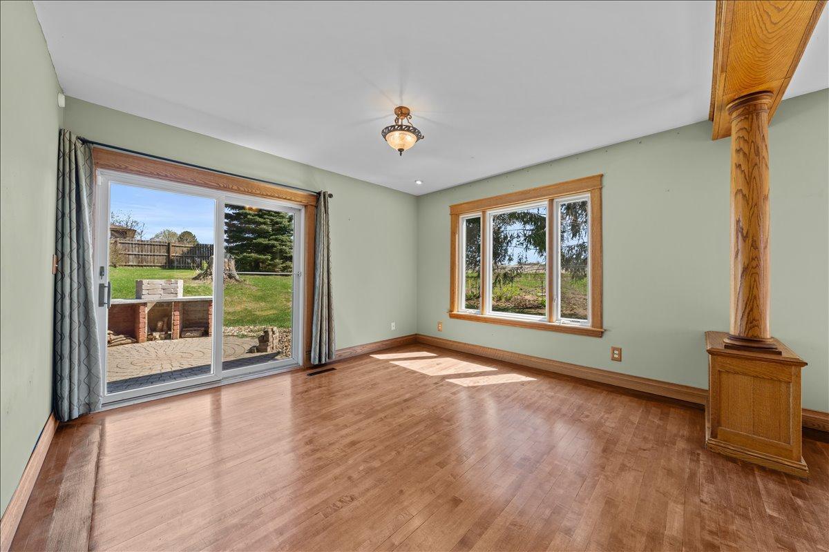 This room could have many uses..family room, dining room, tv room etc. with sliding door to the patio and outdoor kitchen area.