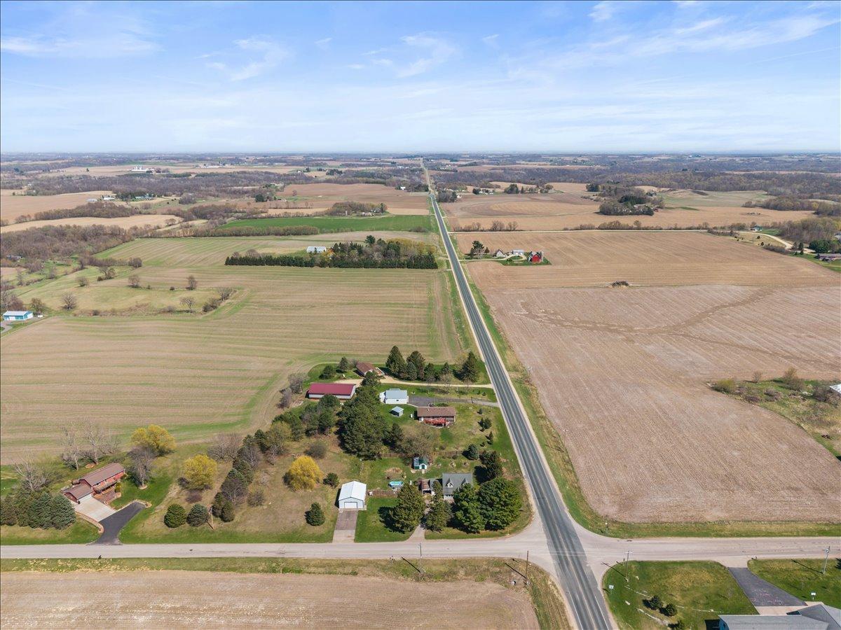 Aerial view of home and building on 1.59 acres. On the corner of County Road V and 690th Street.