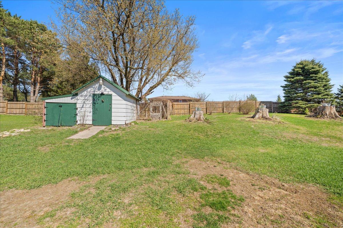 storage shed -16 X 10 with attached lean to 20 X 7 Dog kennel at the rear.