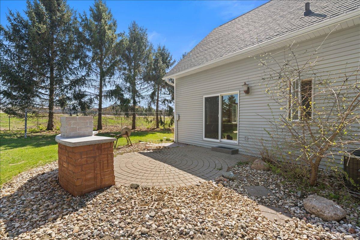 paver patio and outdoor kitchen area