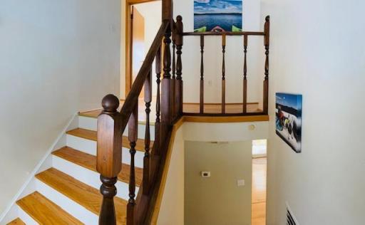 Stairway to 4 bedrooms, 1 bath, bonus room